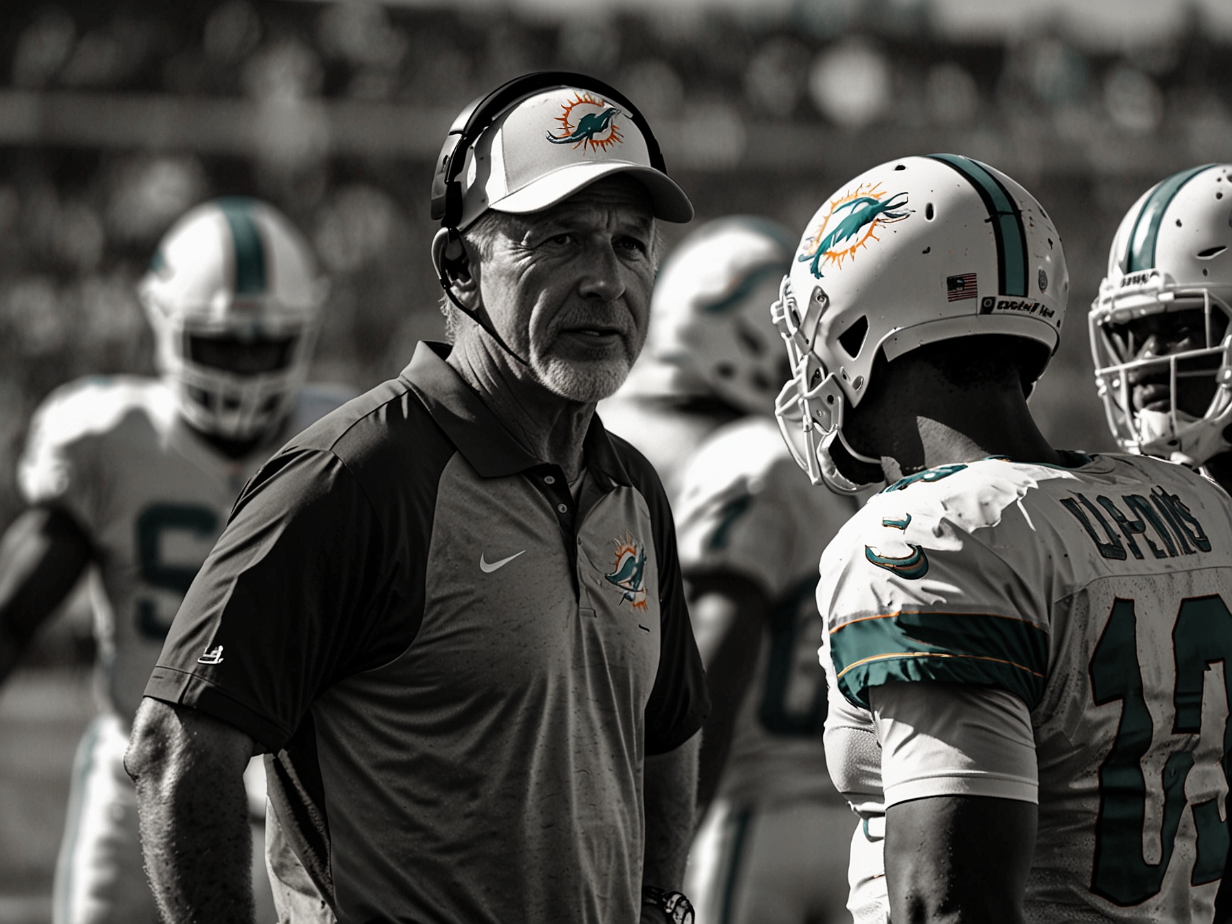 The Miami Dolphins' head coach discussing gameplay strategies with players on the sidelines during an NFL game.