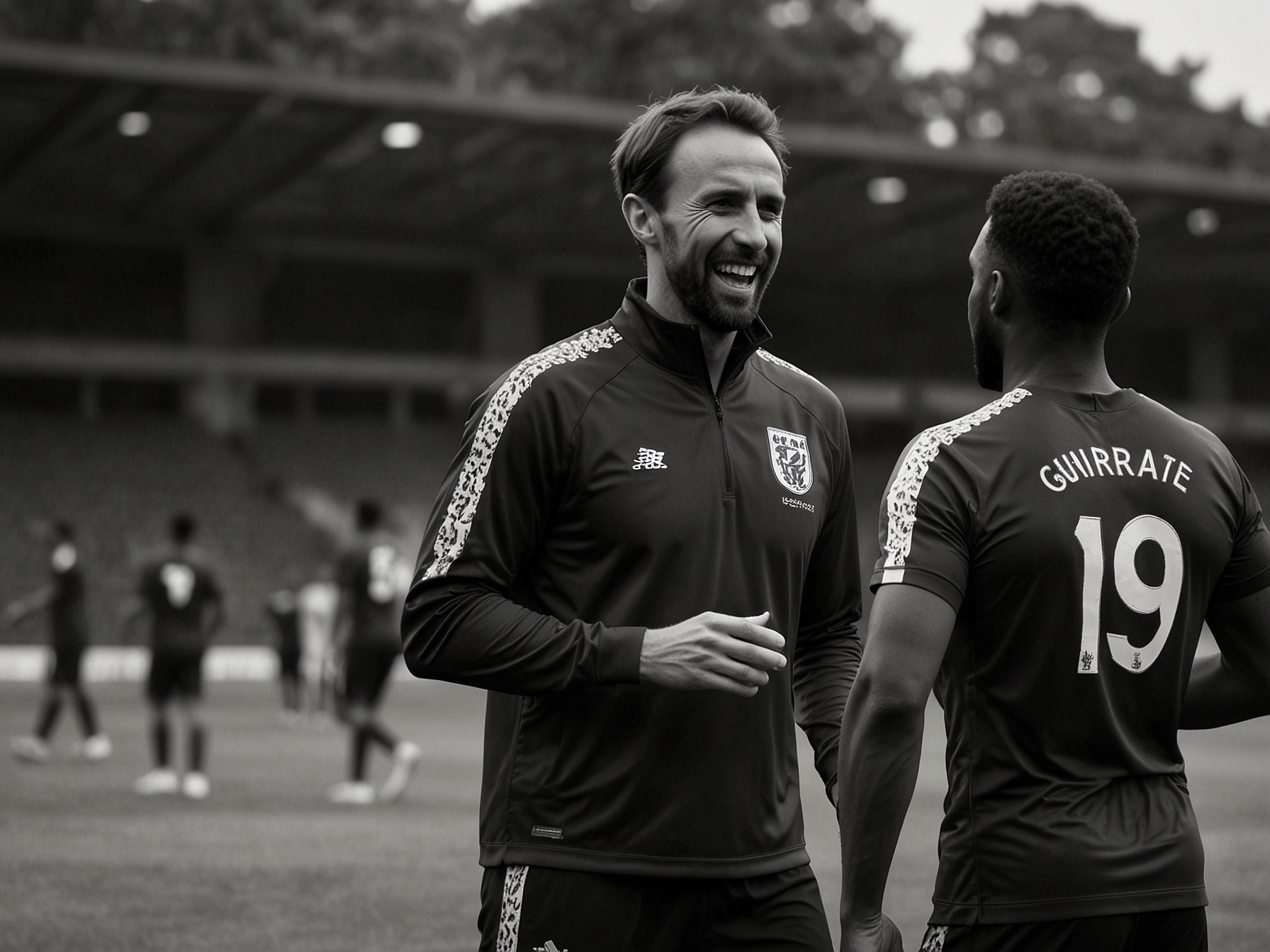 Gareth Southgate engaging with players during a training session, exemplifying his hands-on and motivational coaching style.